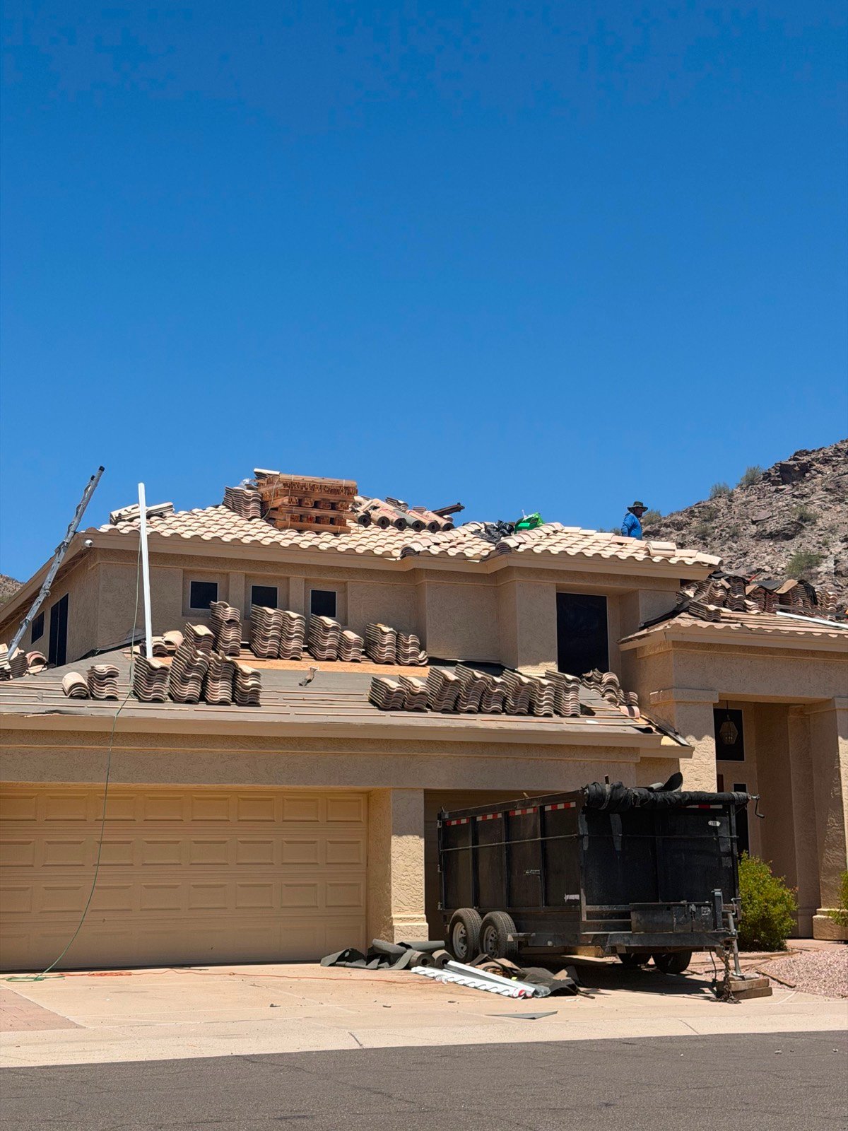 Franco's Construction crew installing a tile roof